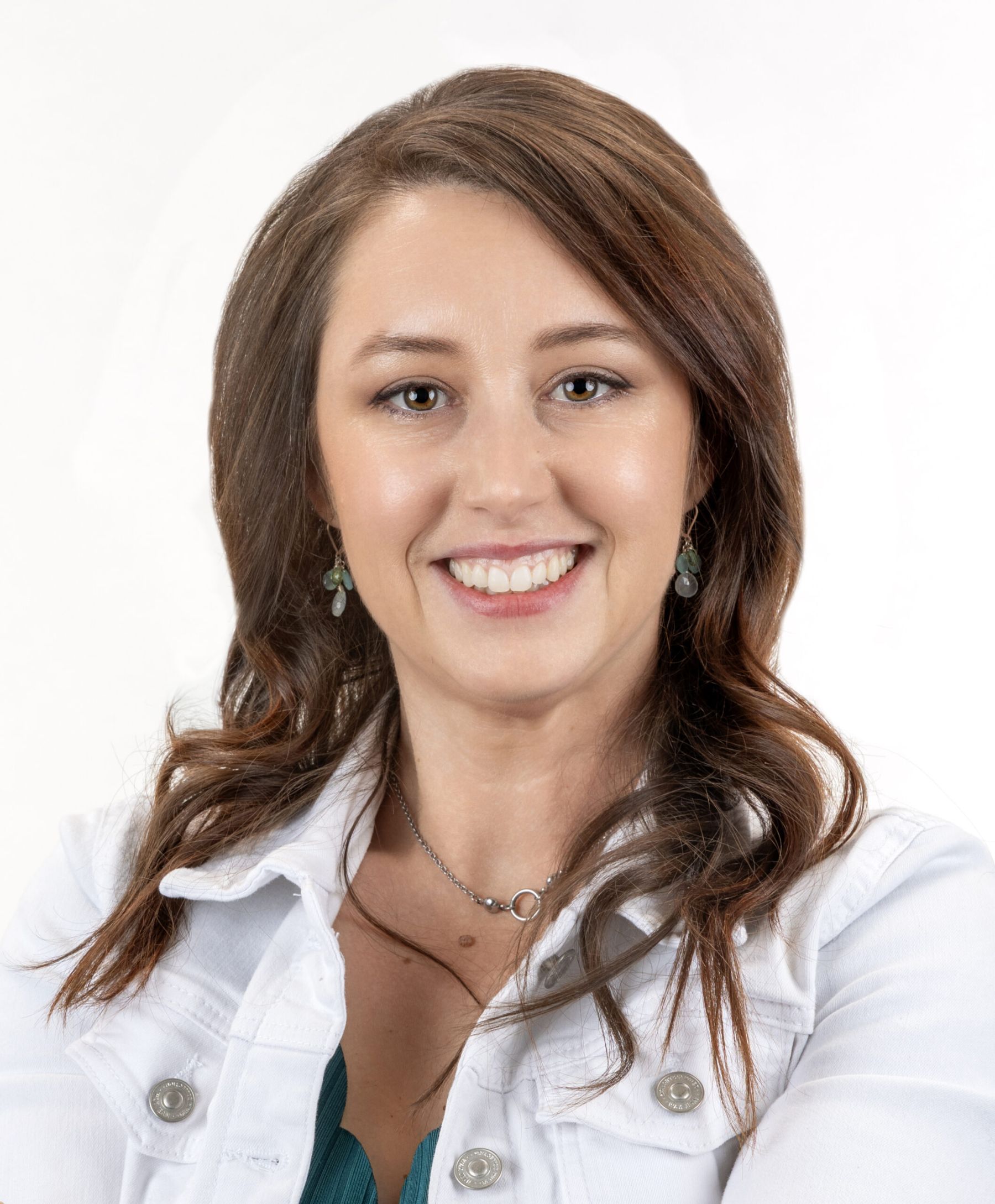 Professional headshot with a relaxed, welcoming smile