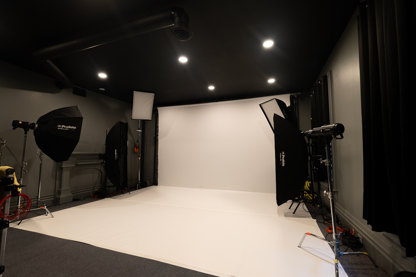 Evans City photography studio with white backdrop and Profoto lighting
