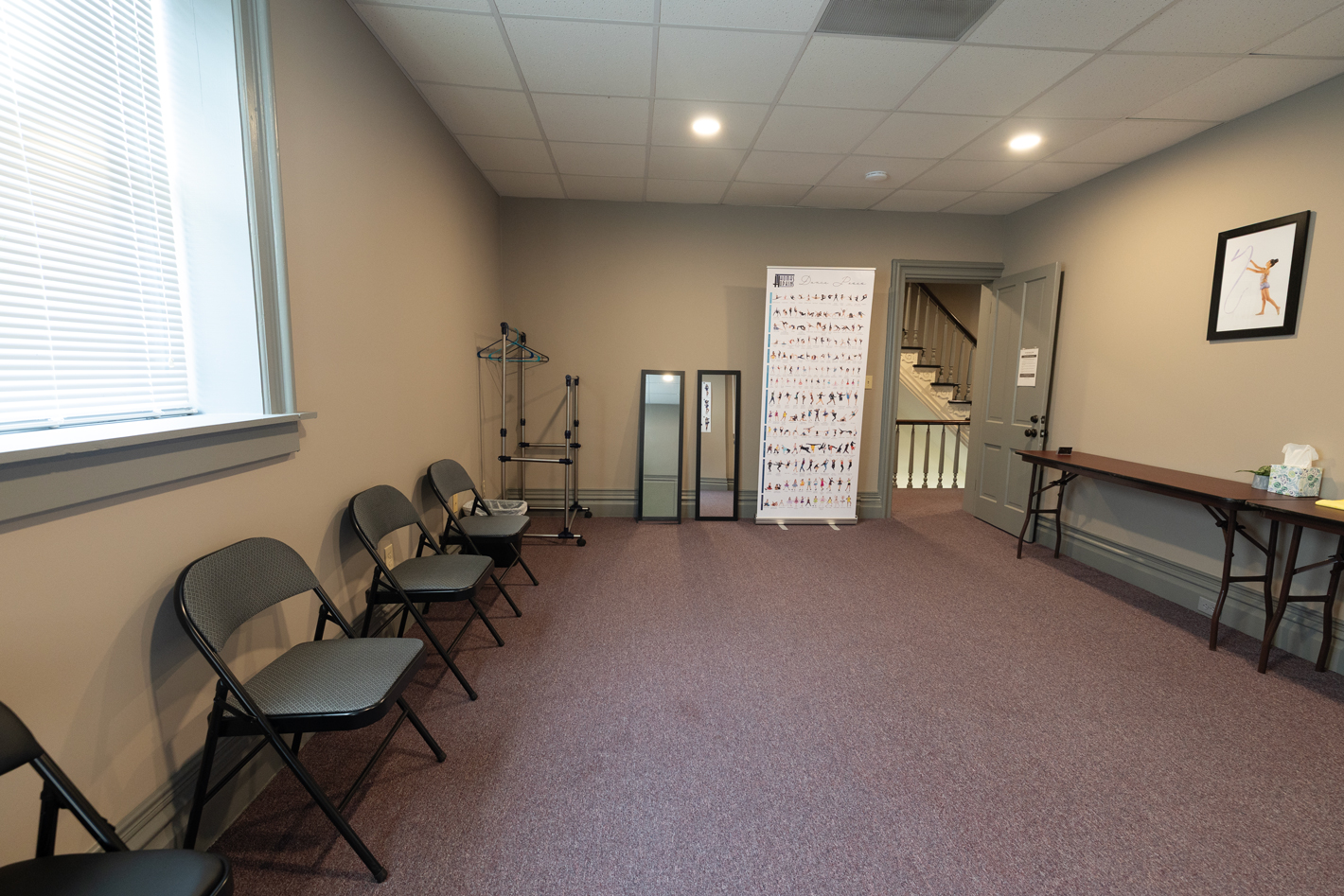 Getting-ready room seating, clothing rack and full-length mirrors